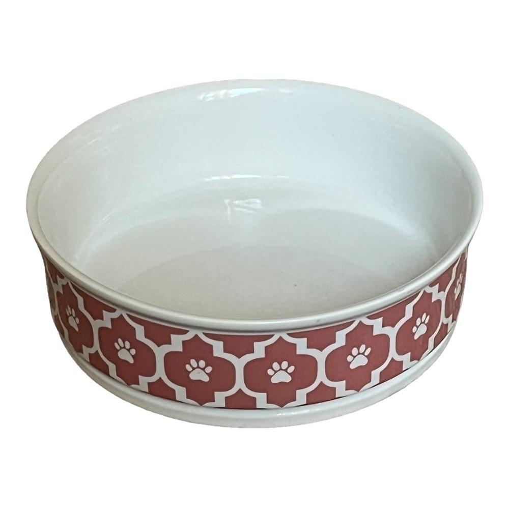 Ceramic dog bowl in white with pink boho print and paw print.